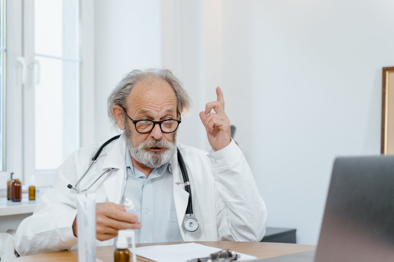 The Art of Drawing Readers In: Your attractive post title goes here Senior doctor in white coat having an online consultation. Medical professional using technology for healthcare.